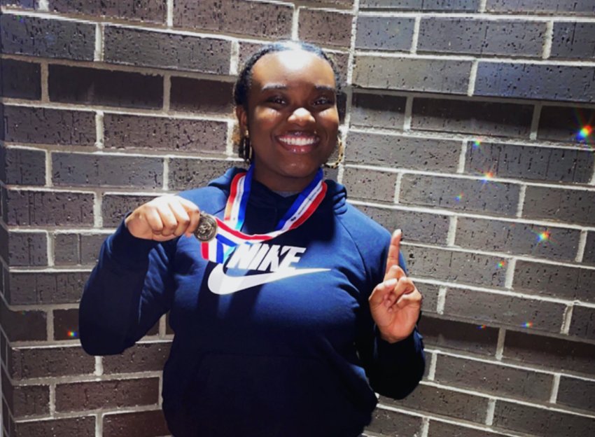 Freshman Marlee Washington shows off her state powerlifting medal.